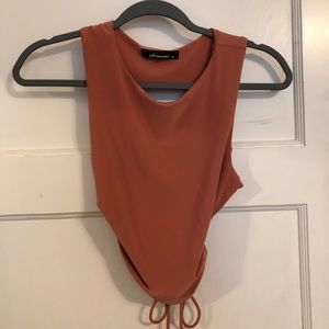 Olivaceous crop cut out tank top with tie back